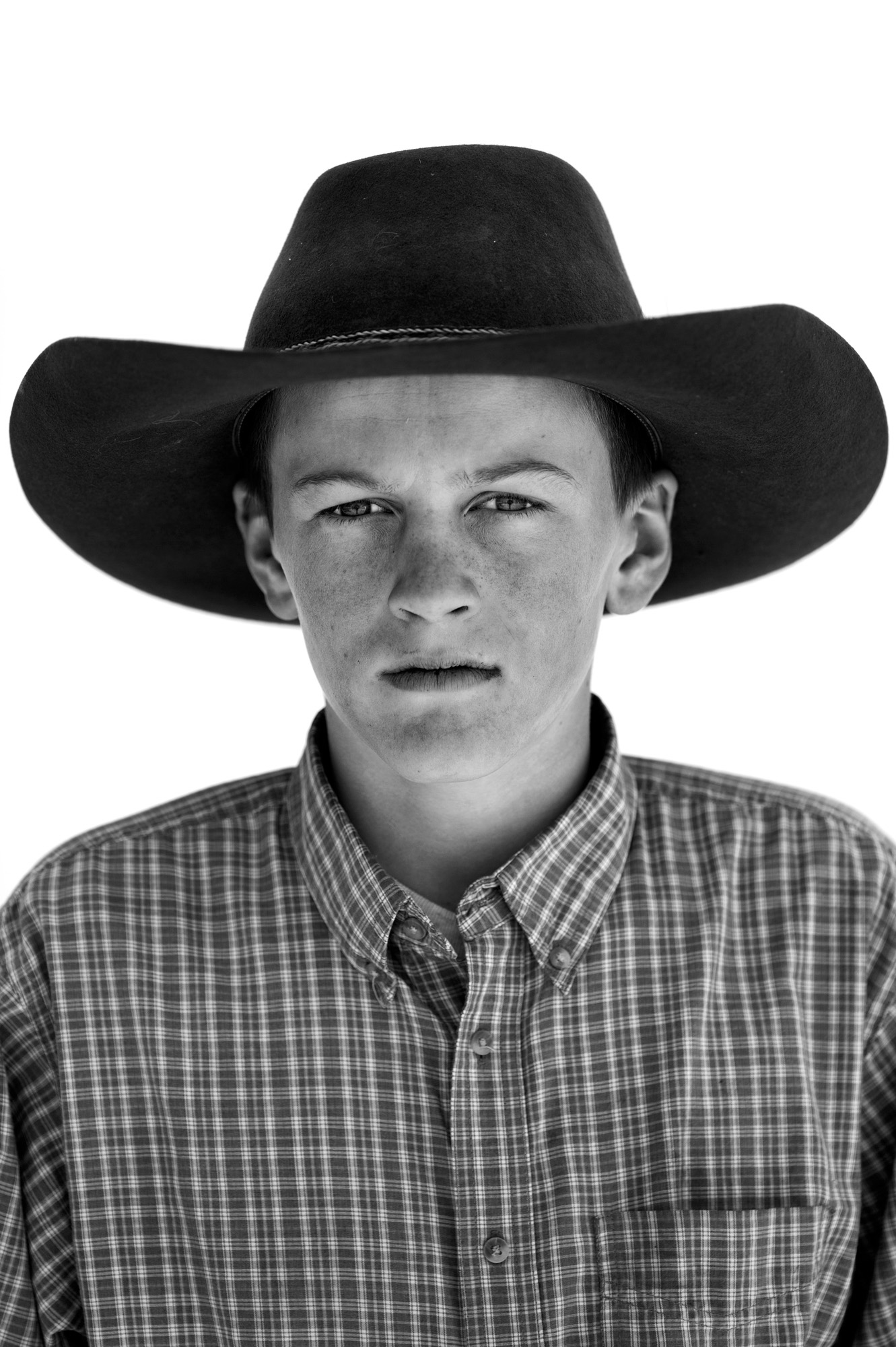 Black and white portrait of a young cowboy in Paradise Valley, NV.