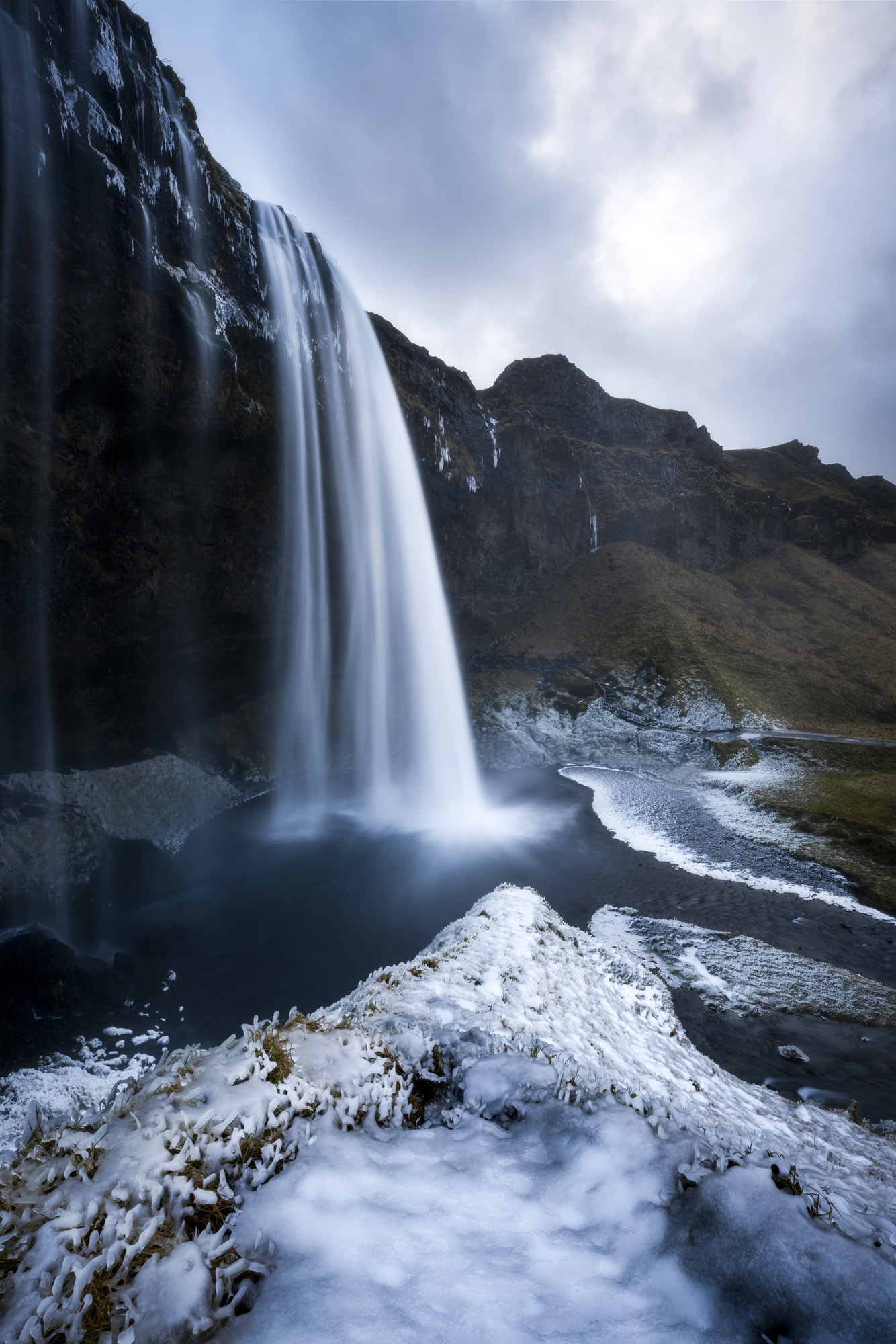 Seljalandsfoss waterfall in the Southern Region of Iceland on a winter day. 