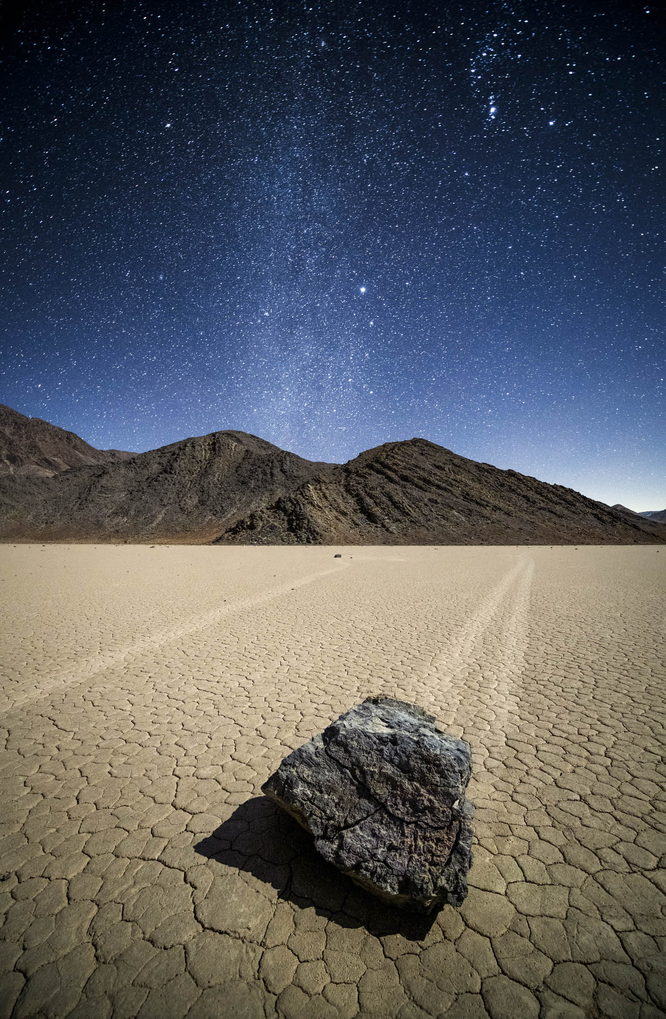 Stone on The Racetrack under the Milky Way in Death Valley National Park, California.